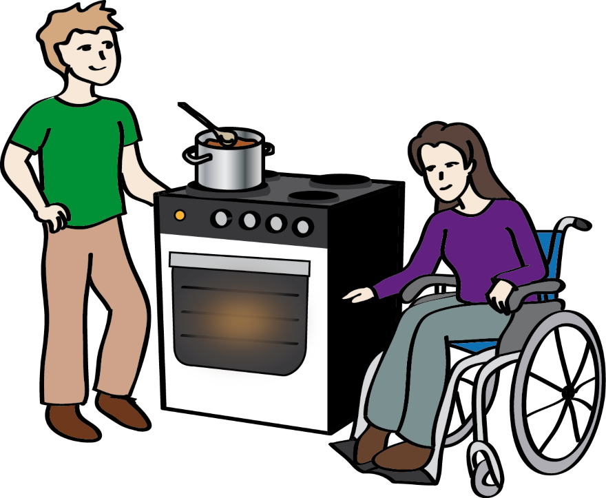 Mann hilft einer Frau im Rollstuhl beim Kochen